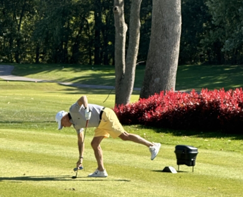 2023 golf scramble player picking up his ball